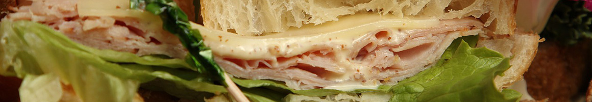 Eating Deli Sandwich at Midtown Deli restaurant in Greenville, SC.